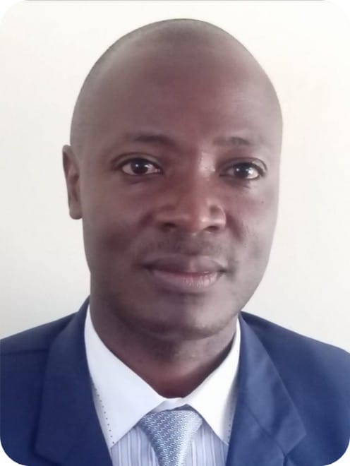 A man in a blue suit and tie poses for a formal headshot against a plain light background, representing expertise in Crop Modelling and Multi-Stress Research focused on maize.